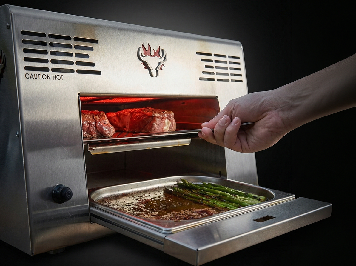 Person using a salamander grill with showcasing drip tray collecting jus.
