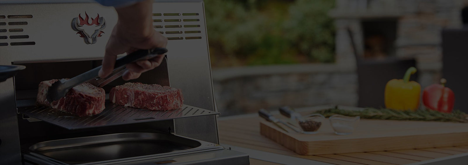 Man placing steak on Schwank Grill 